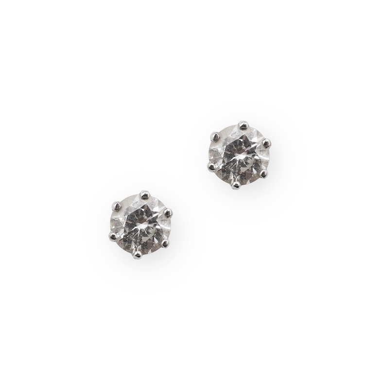 A pair of diamond stud earrings